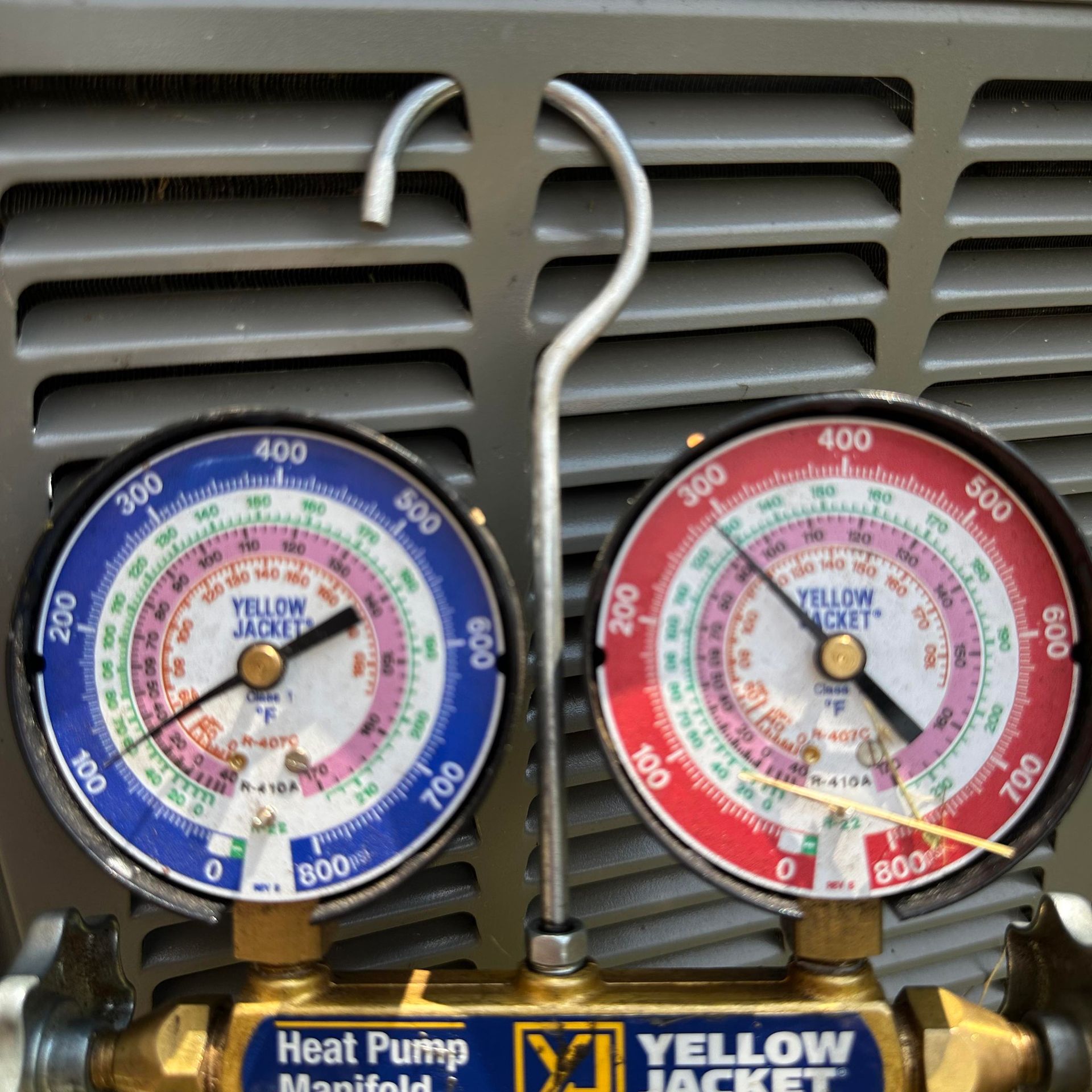 A wooden fence with a gate attached to it.