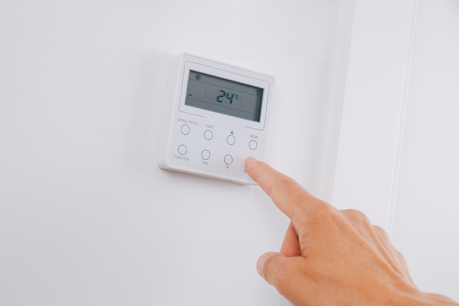A wooden fence is sitting on top of a lush green field.