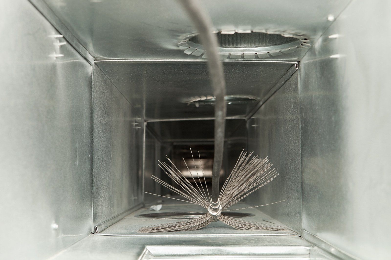 A wooden fence is sitting on top of a lush green field.
