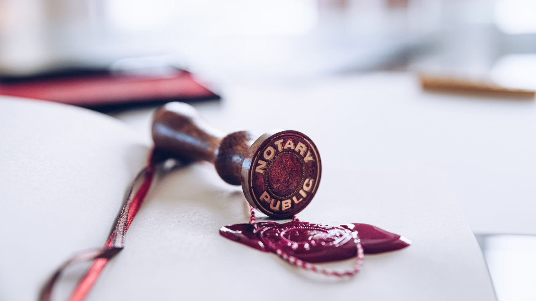 A notary public stamp is sitting on top of a piece of paper.