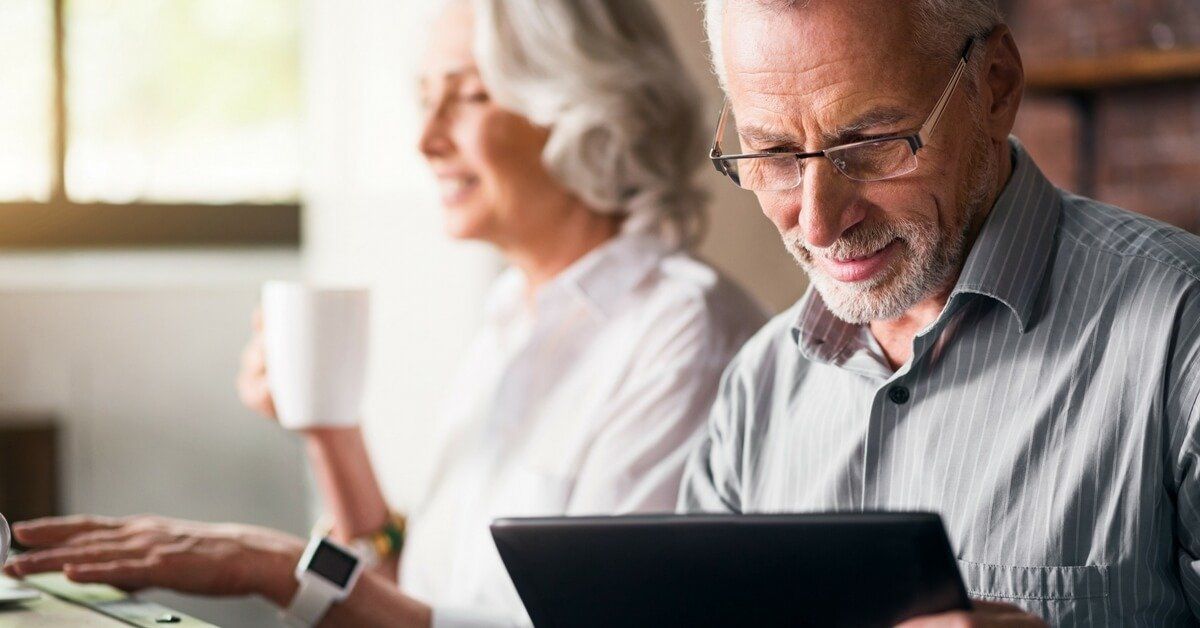 choosing the right funeral home senior couple man using tablet