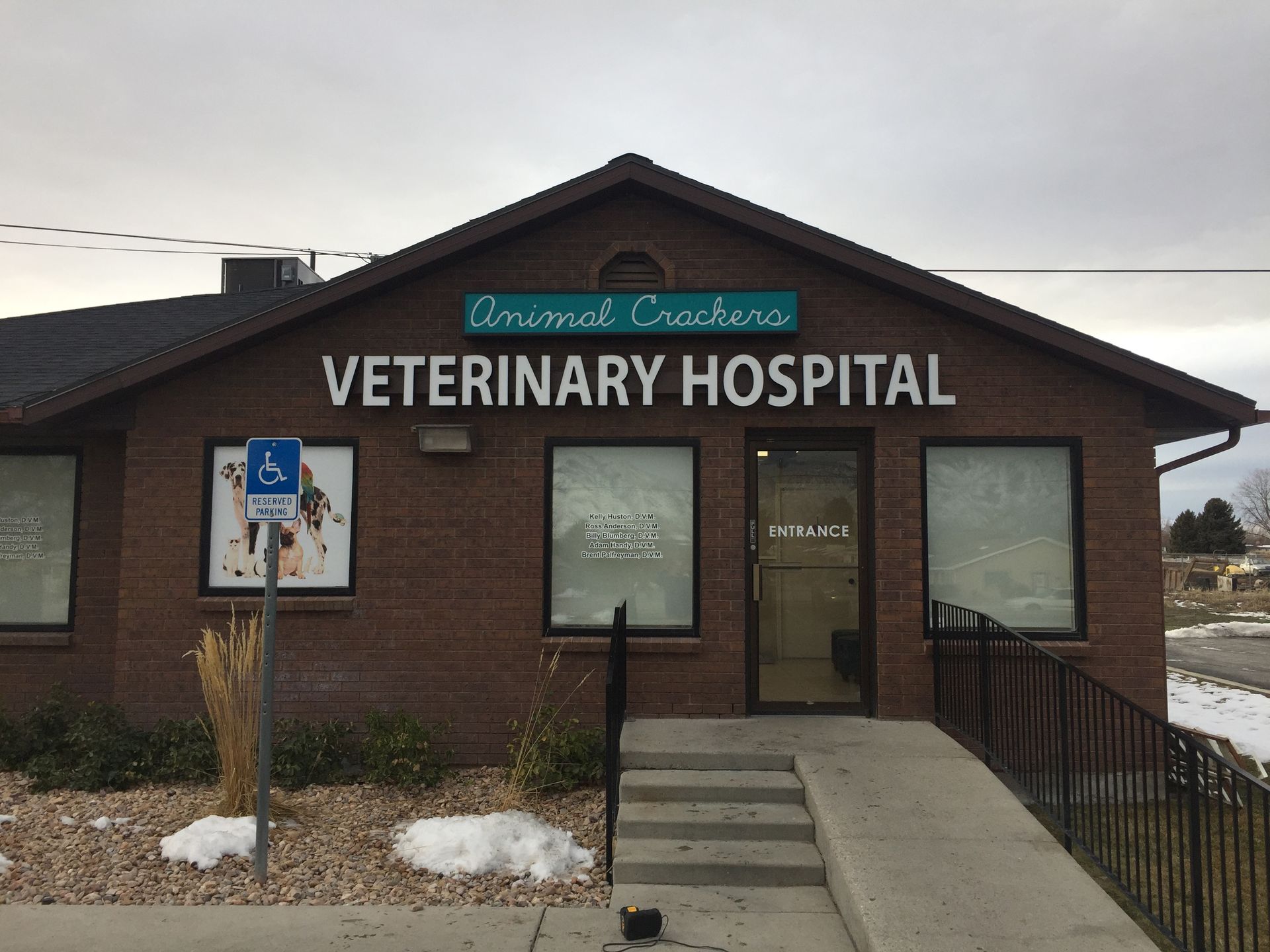 A brick building with a sign that says veterinary hospital A brick building with a sign that says veterinary hospital