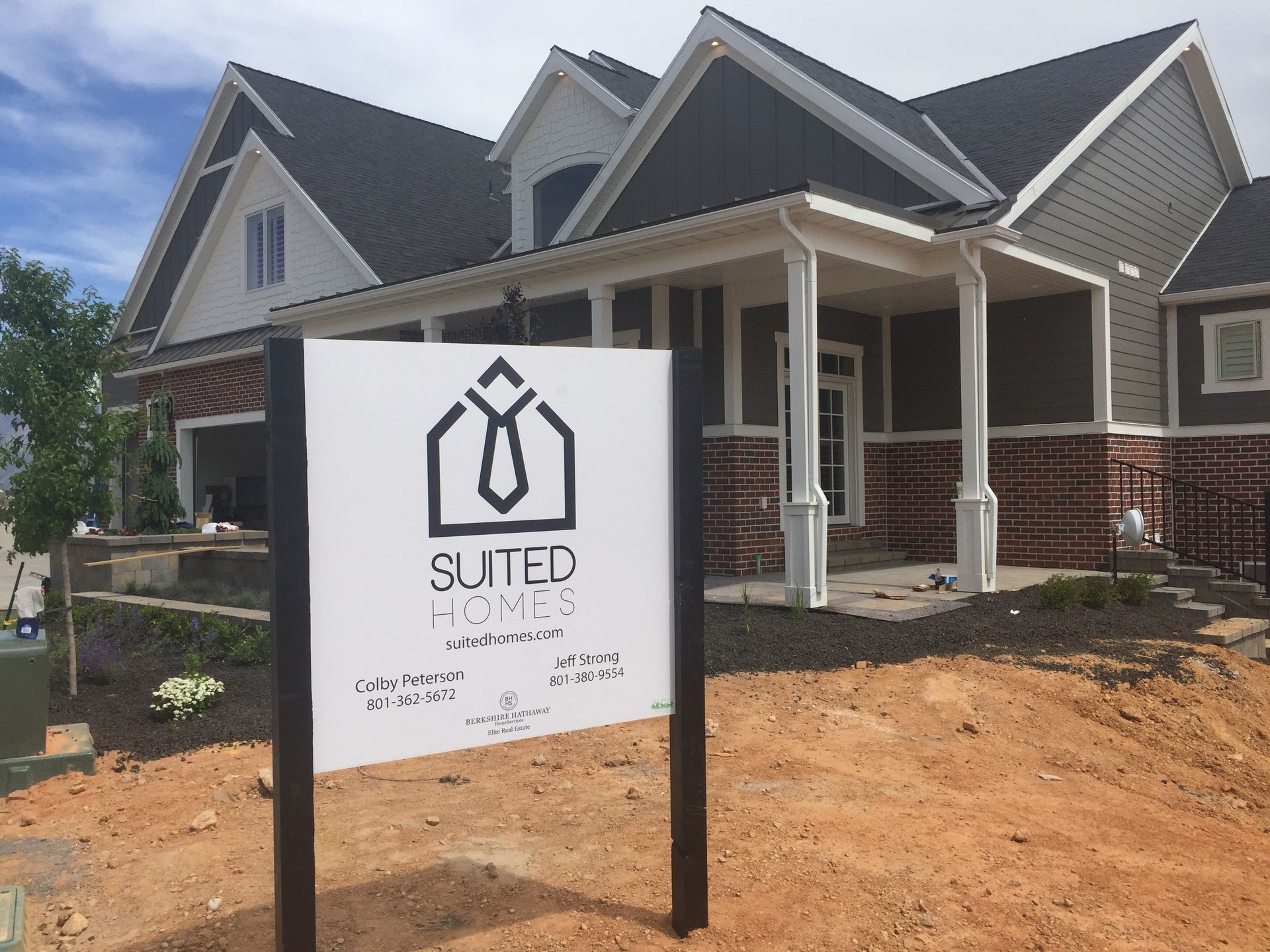 A suter homes sign in front of a house A suter homes sign in front of a house