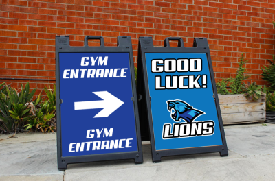A blue sign that says gym entrance on it A blue sign that says gym entrance on it