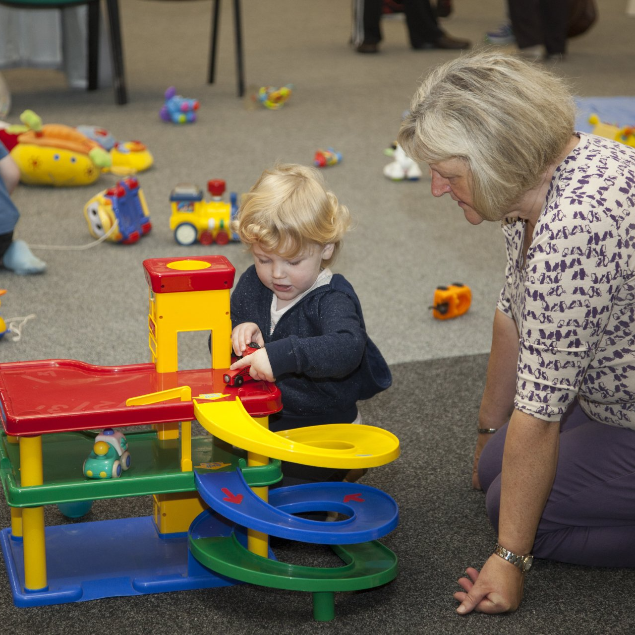child playing with a grandparent