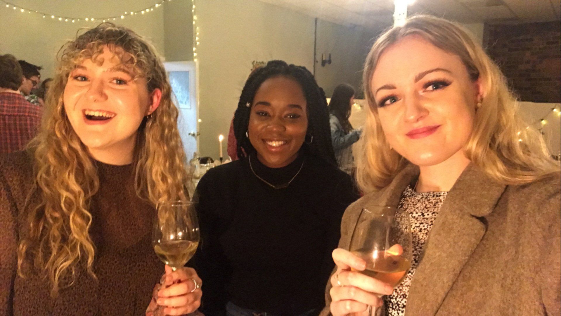 3 women enjoying cocktails at a feast night 