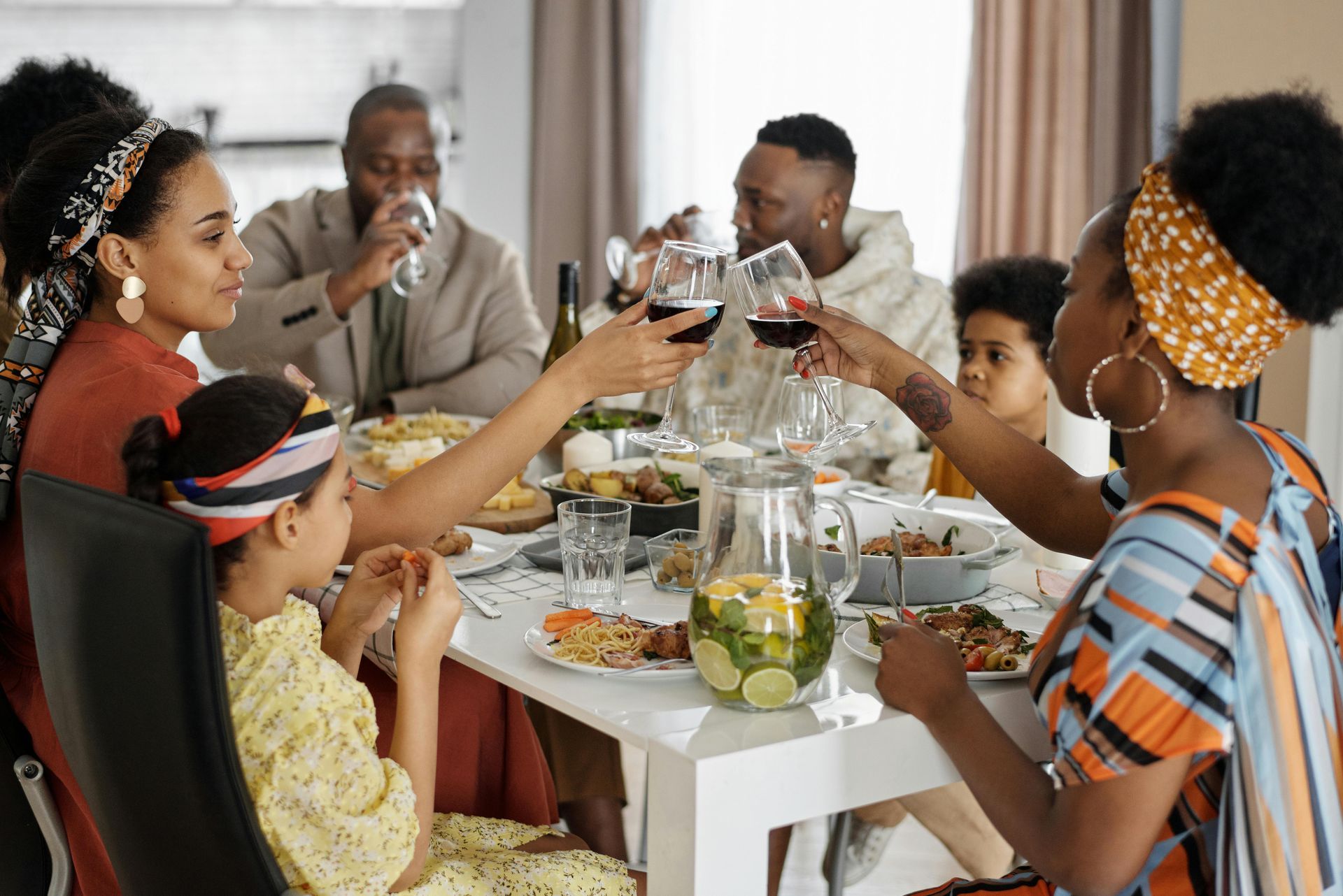 A family is sitting at a table eating together