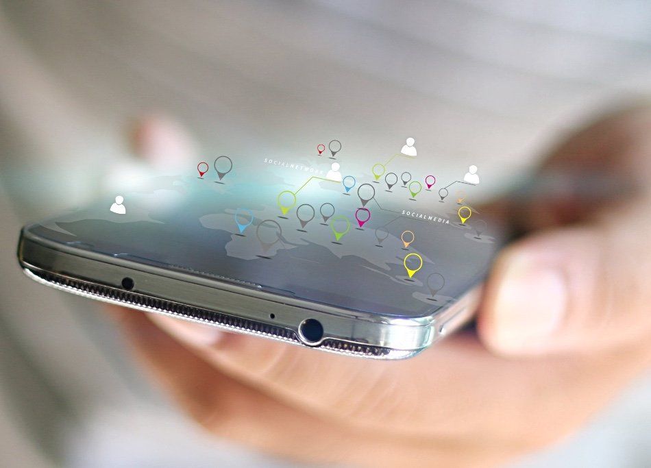 A person is holding a cell phone in their hand.