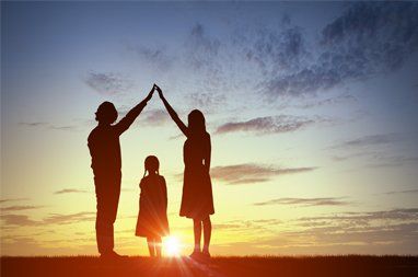 Family silhouette from sun