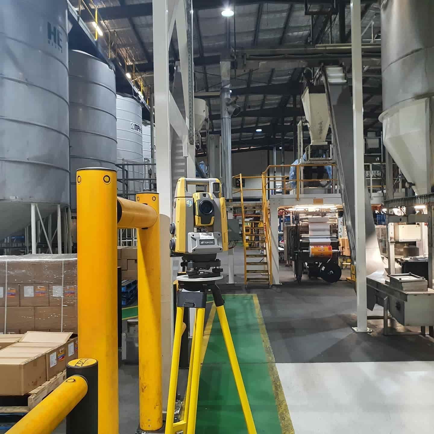 A Yellow Tripod Is In The Middle Of A Factory — Western Survey Pty Ltd In Dubbo, NSW