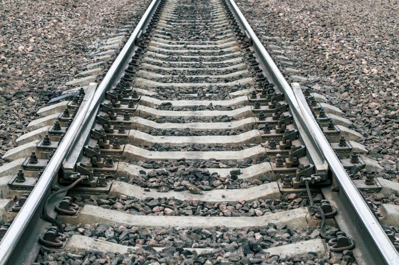 A Close Up of a Train Track With a Lot of Rocks on It — Western Survey Pty Ltd In Dubbo, NSW