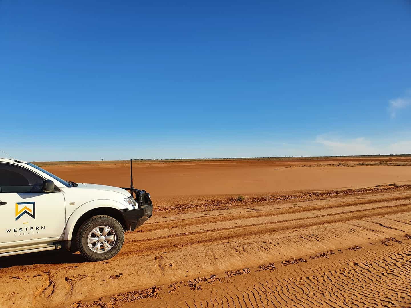A White Truck Is Parked On A Dirt Road — Western Survey Pty Ltd In Dubbo, NSW