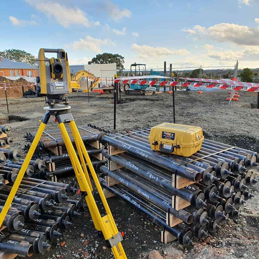 A Yellow Box Is Sitting On Top Of A Pile Of Pipes — Western Survey Pty Ltd In Forbes, NSW