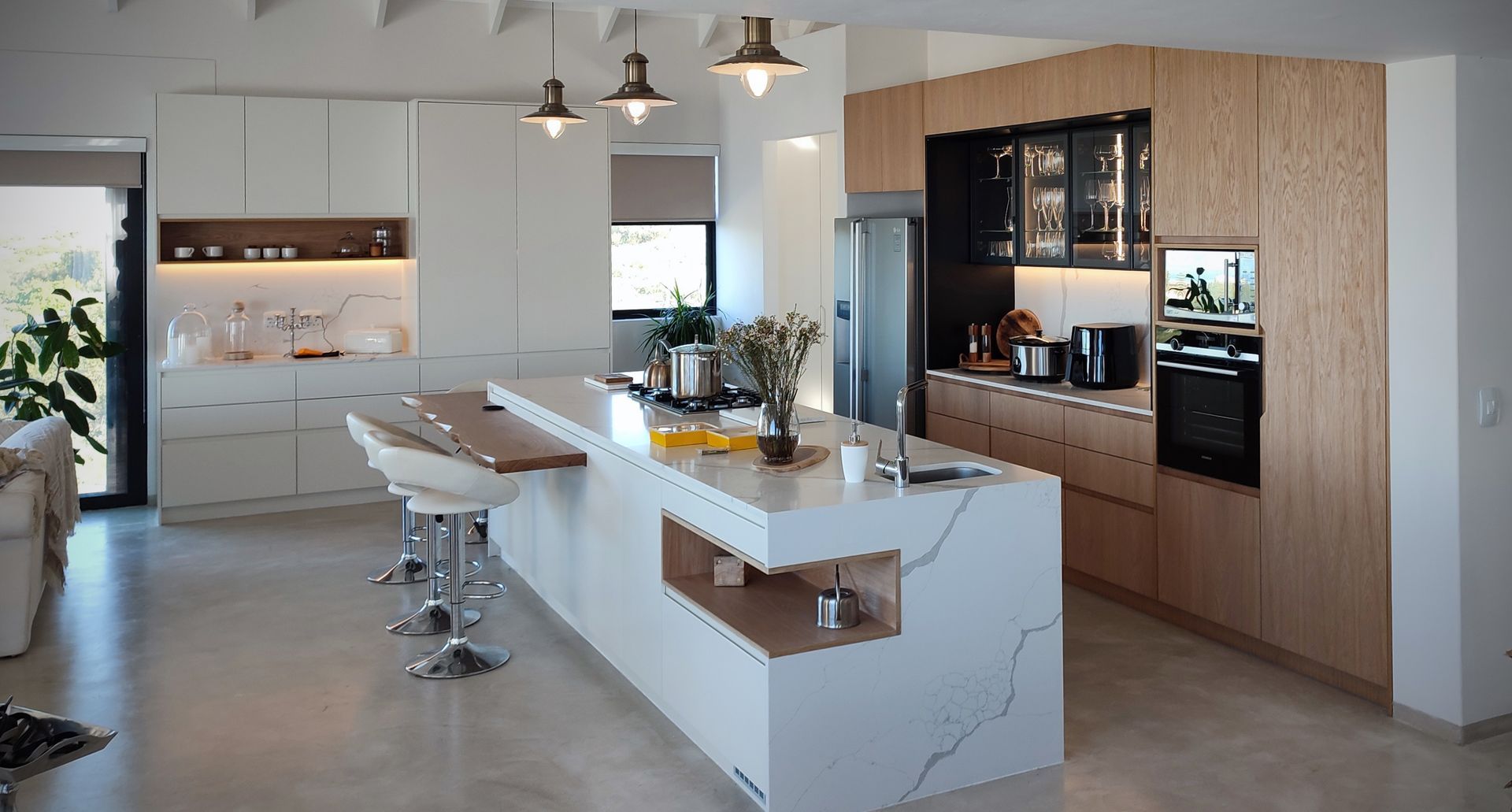 A kitchen with a large island in the middle of the room.