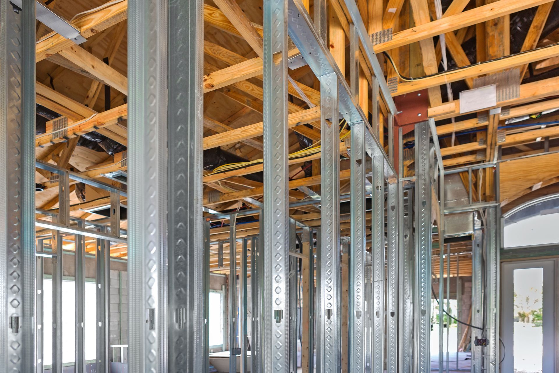 A house is being built with metal frames and wooden beams. — Kansas City, KS — Glenn Marsee & Son Foundation Repair Inc.