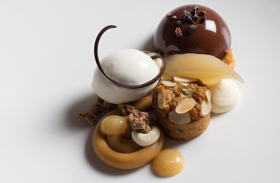 A white plate topped with a variety of desserts