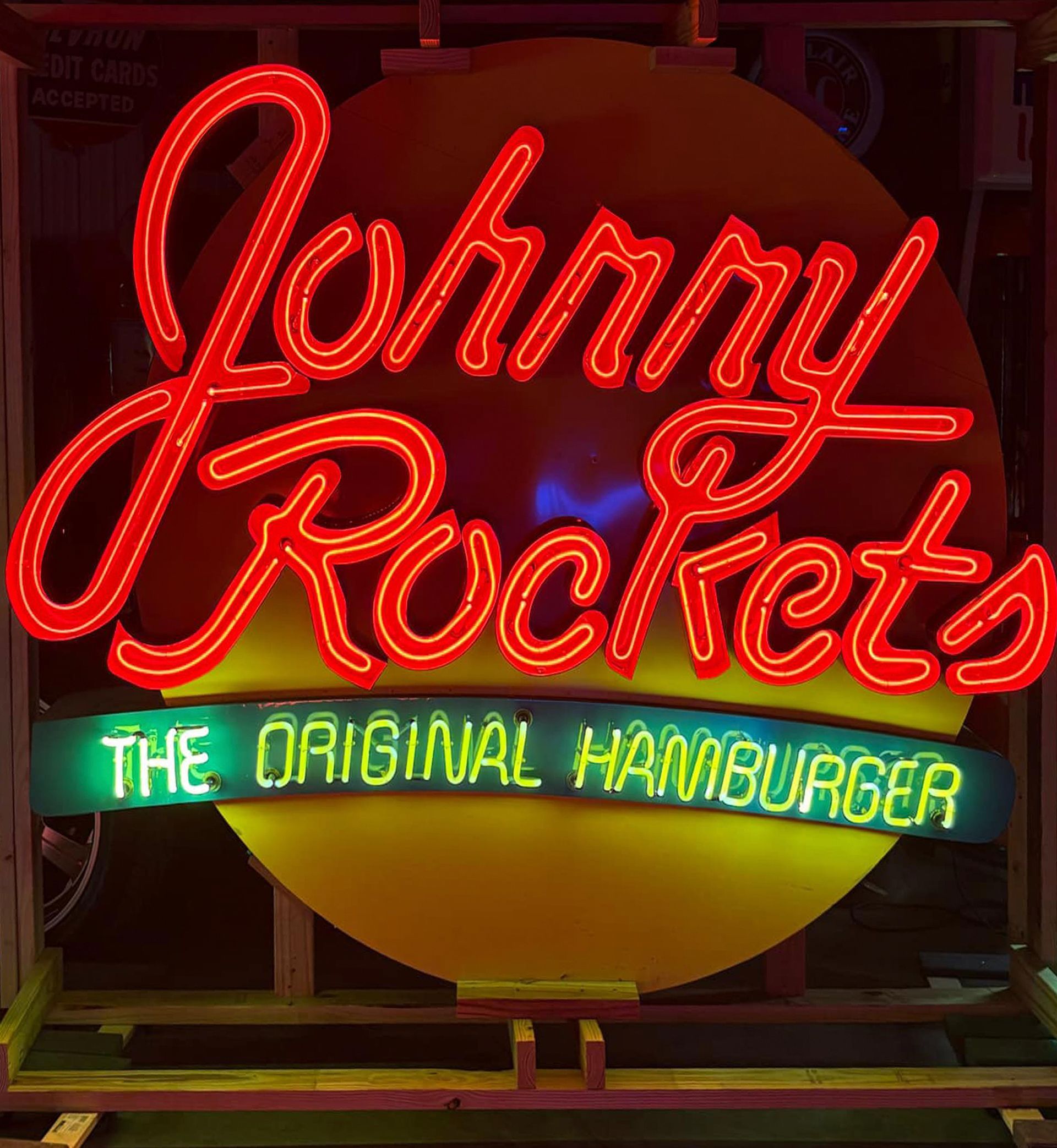Neon Johnny Rockets restaurant sign in red and green.