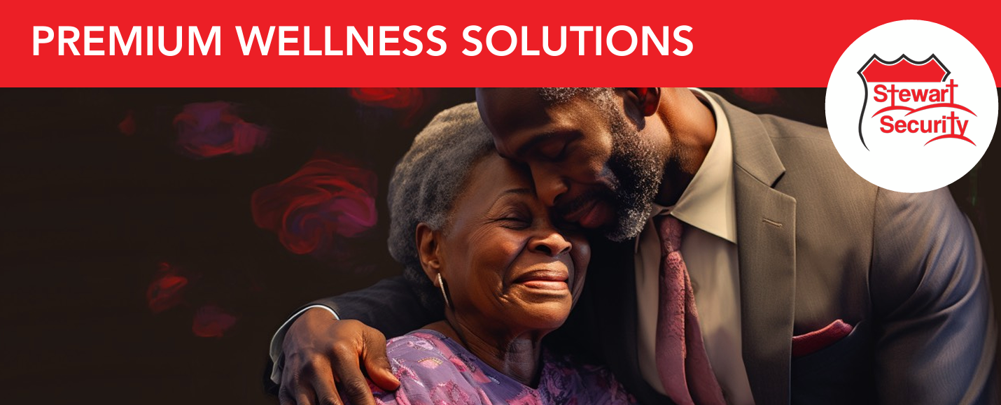 A man in a suit hugging an older woman with the words premium wellness solutions above them