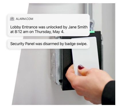 A person is using a security card to unlock a door.