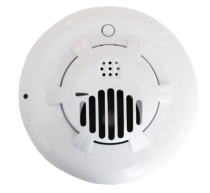 A white smoke detector with a smiley face on it
