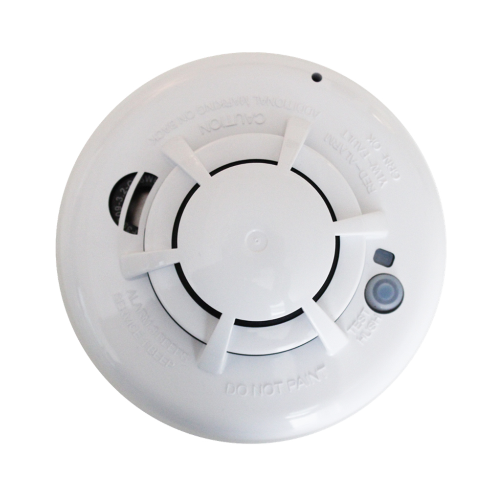A white smoke detector that says do not max on it