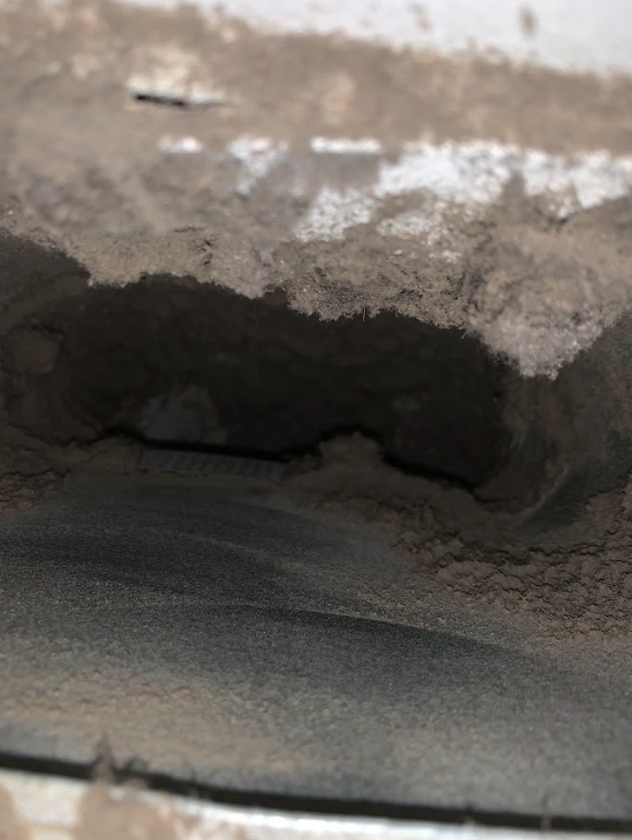 Professional Touch Carpet Upholstery Cleaning - A close up of a hole in a concrete wall.