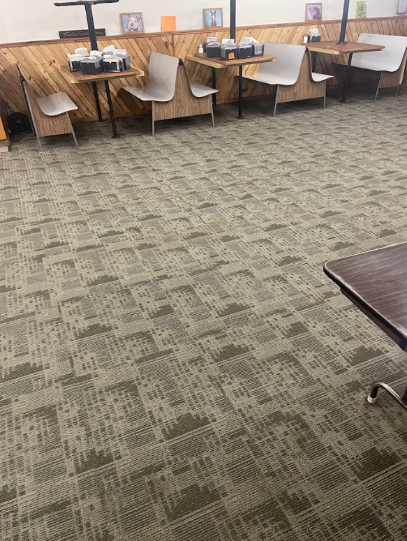 Professional Touch Carpet Upholstery Cleaning - A restaurant with tables and chairs and a carpeted floor.
