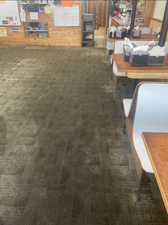 Professional Touch Carpet Upholstery Cleaning - A restaurant with tables and chairs and a carpeted floor.