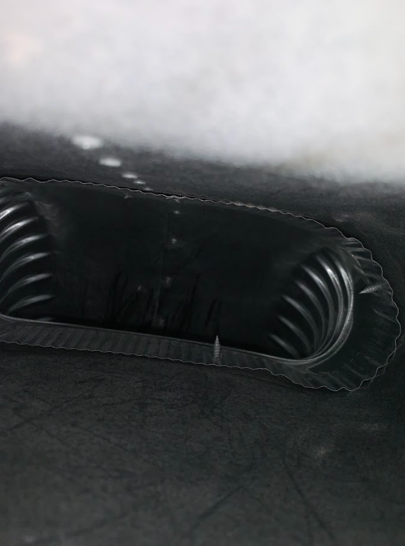 Professional Touch Carpet Upholstery Cleaning - A close up of a paper plate holder on a black surface.