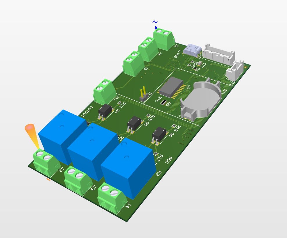 PCB (printed circuit board) with green terminals, blue relays, and integrated components.