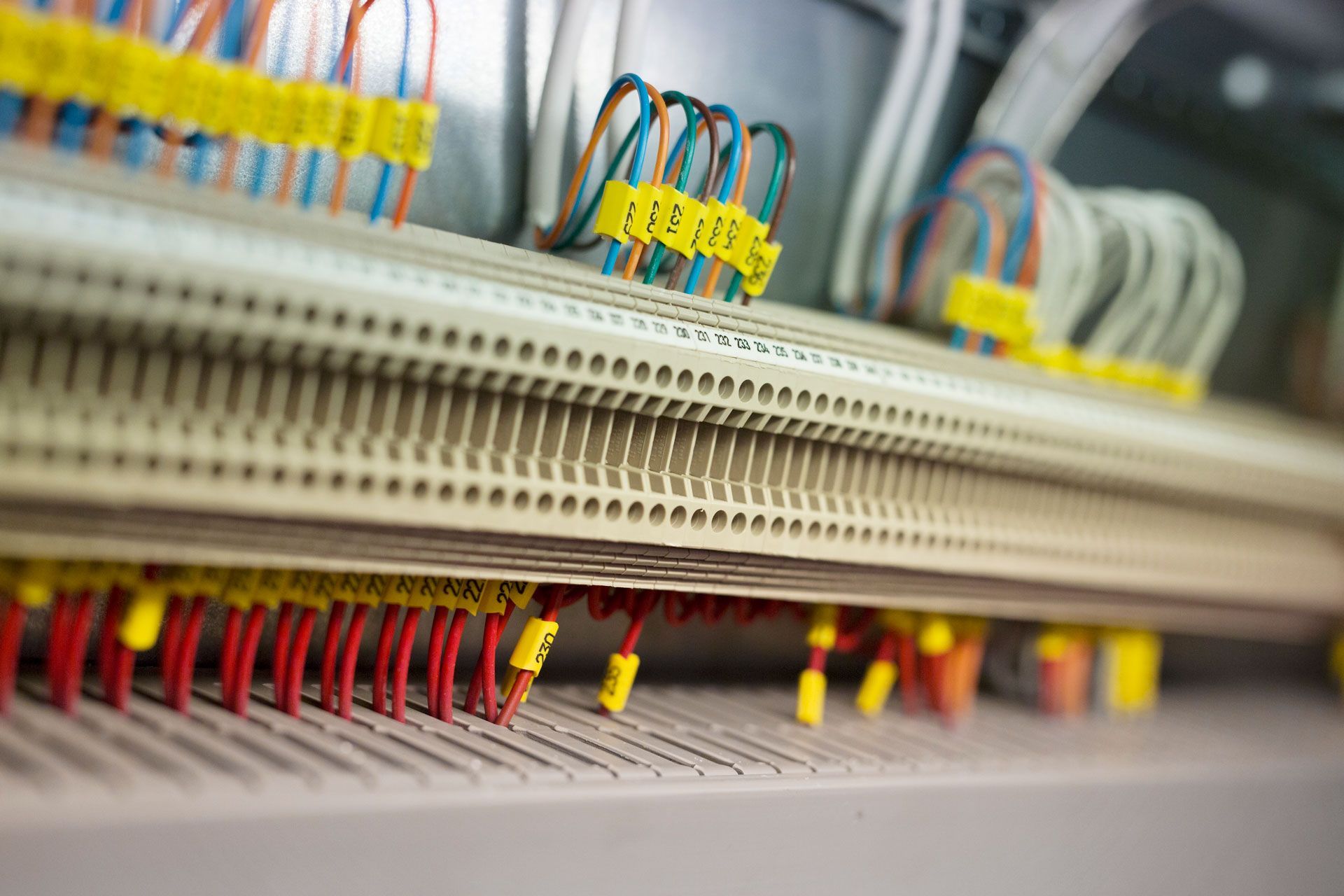 Control panel with coloured wires and terminal blocks.
