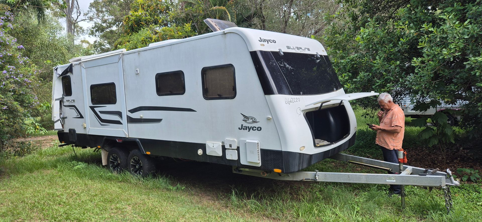 A Caravan Parked on Grass — Revive Caravan Repairs in Kippa-Ring, QLD