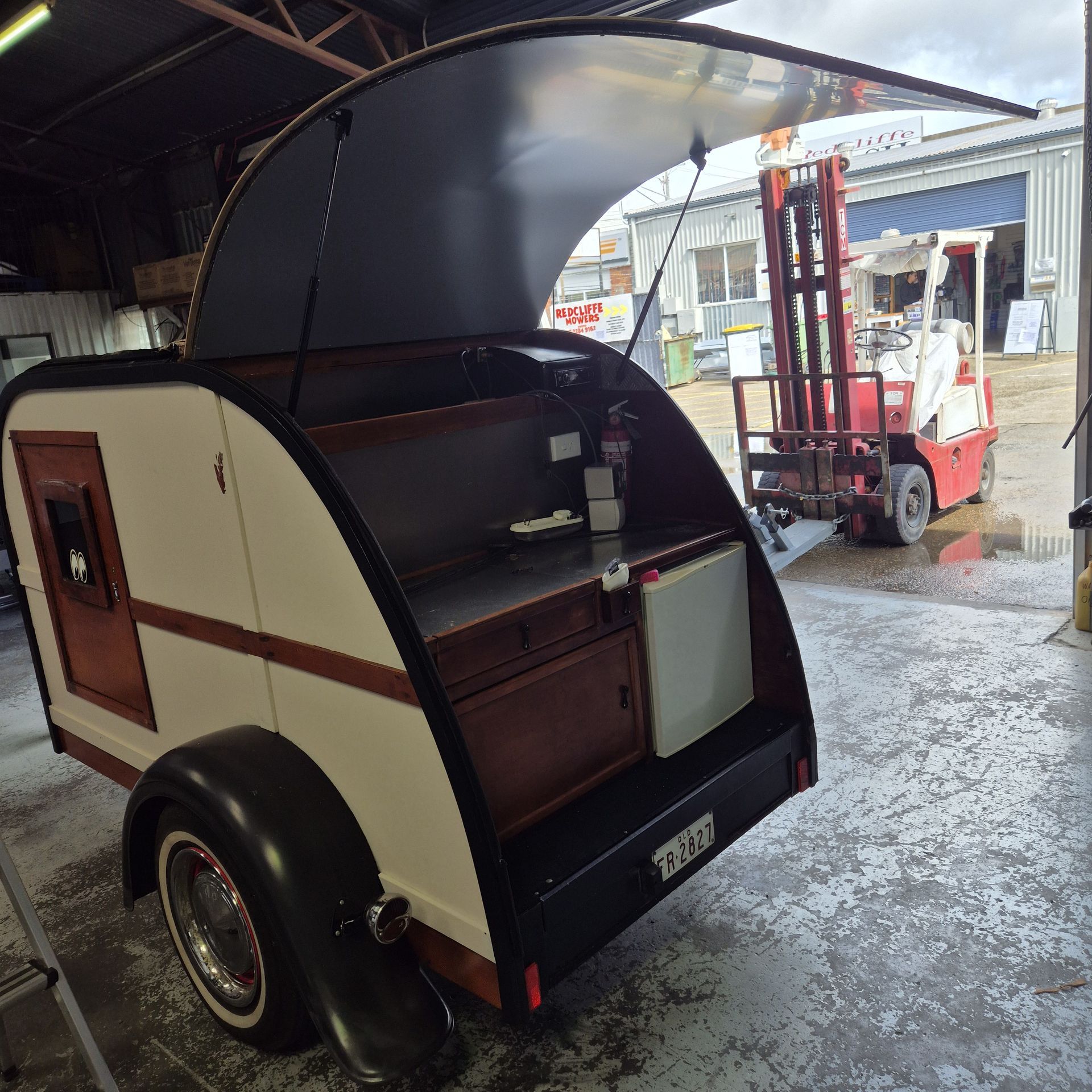 Teardrop Camper With Open Hatch, Cream and Brown Exterior — Revive Caravan Repairs in Kippa-Ring, QLD