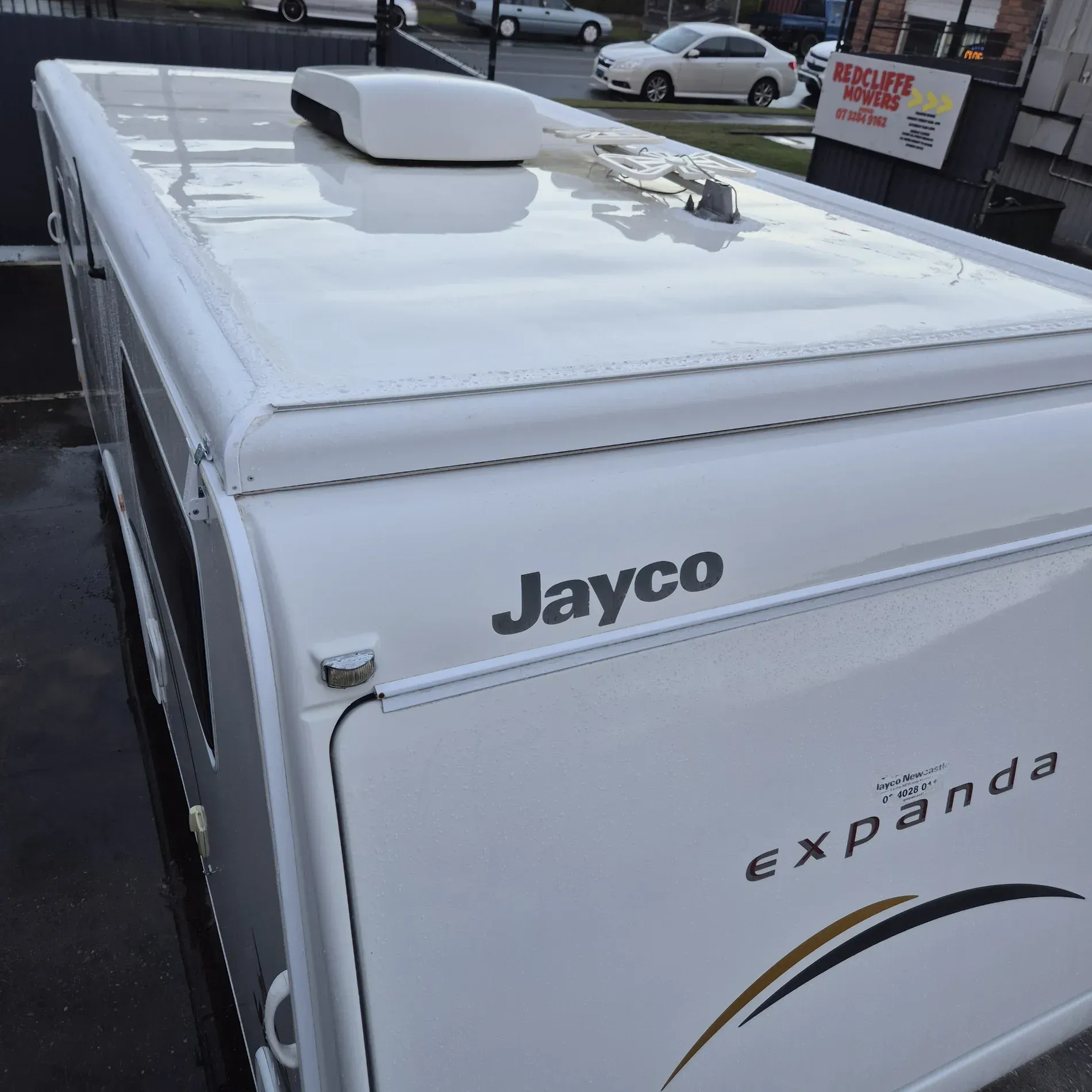 White Jayco Expanda camper trailer with a white roof — Revive Caravan Repairs in Kippa-Ring, QLD