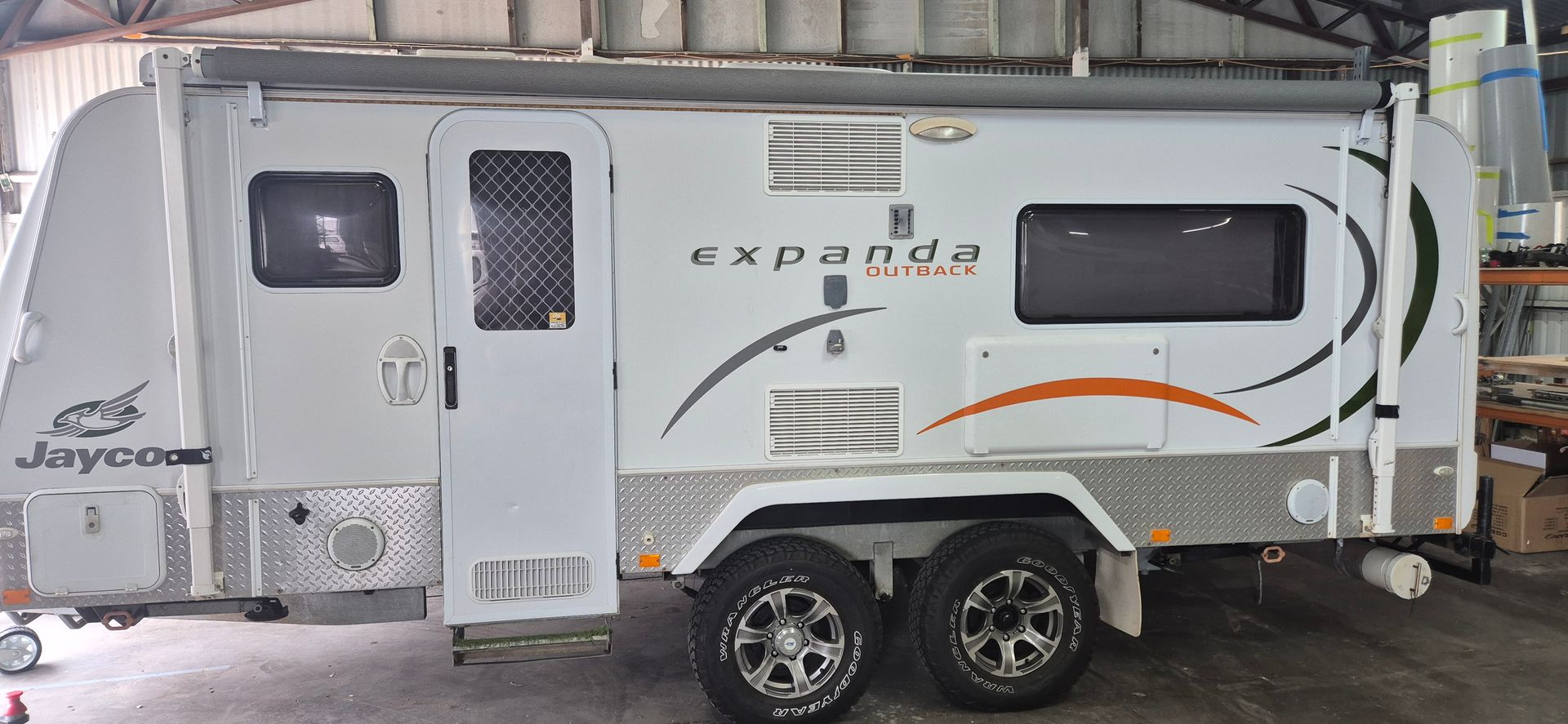 A Caravan Parked Inside a Building — Revive Caravan Repairs in Kippa-Ring, QLD