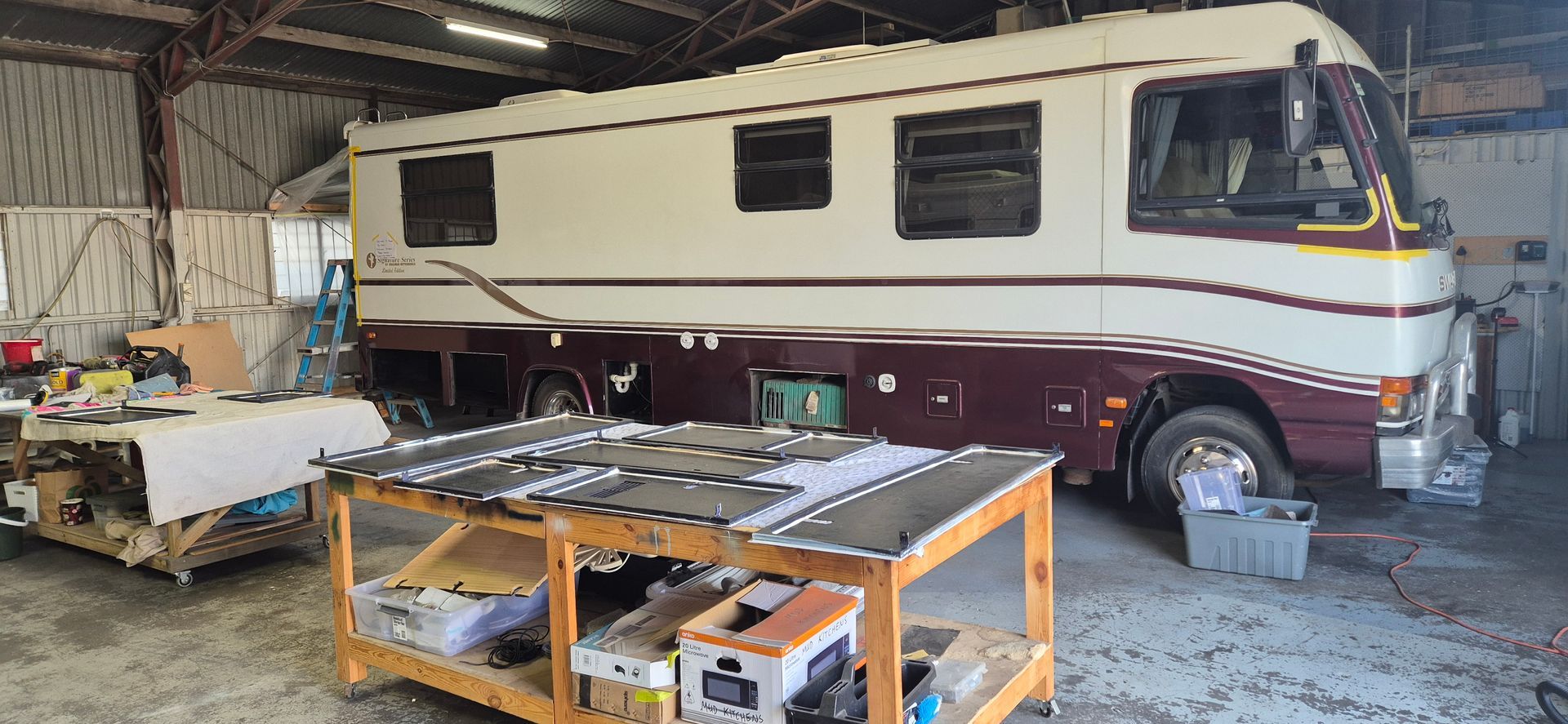 A Large Rv Inside a Workshop — Revive Caravan Repairs in Kippa-Ring, QLD