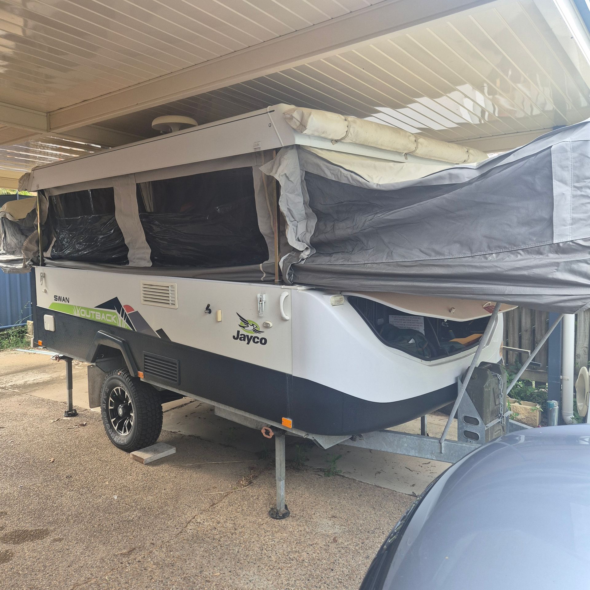 A Camper Trailer Parked Under a Carport — Revive Caravan Repairs in Kippa-Ring, QLD