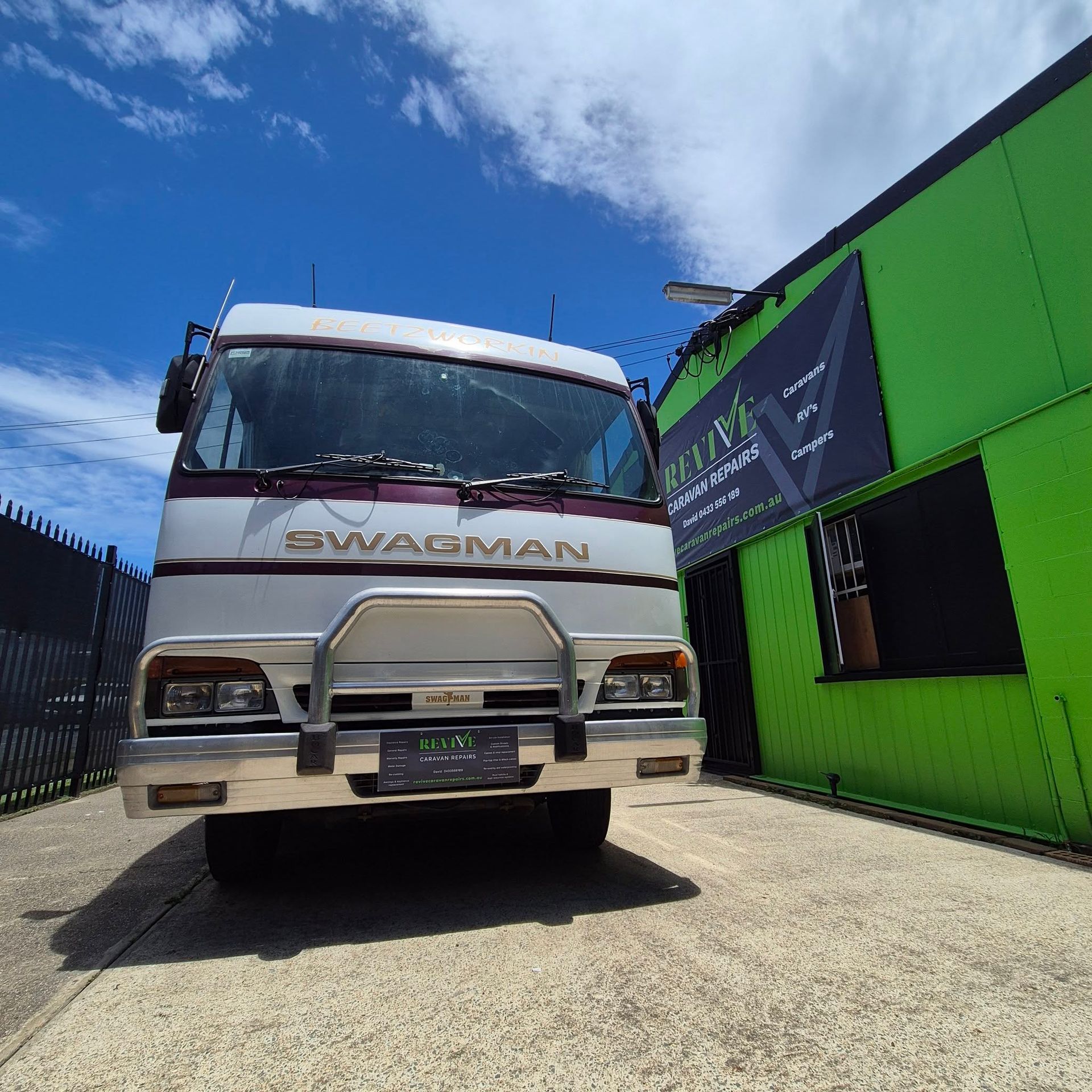 A Truck with A Silver Bull Bar Parked in Front of A Building — Revive Caravan Repairs in Kippa-Ring, QLD