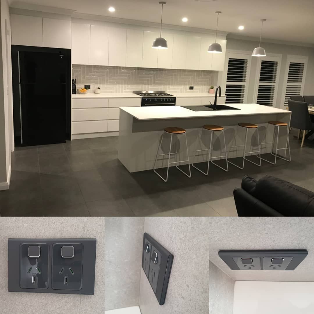 A Well Organized Kitchen With A Large Table And Lighting — Electrician In Wagga Wagga, NSW