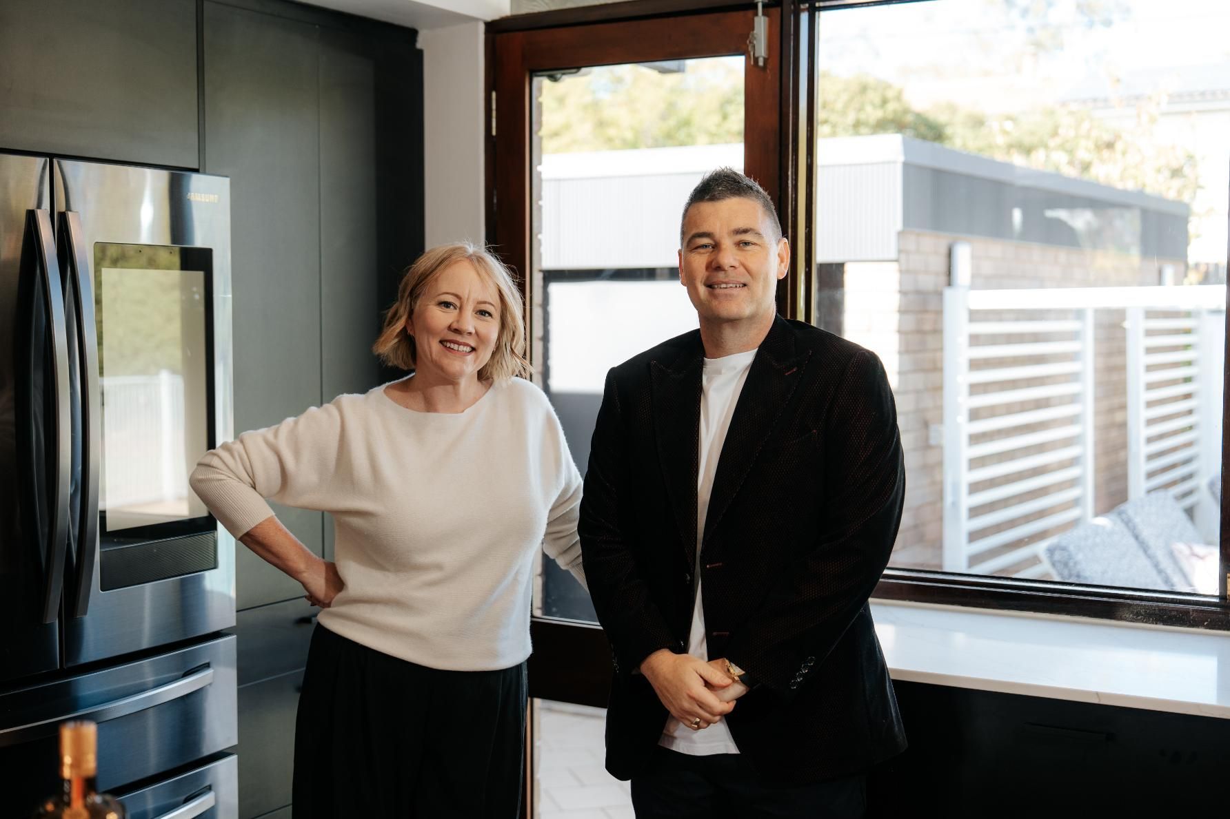 A Man and a Woman Are Standing Next to Each Other — Hyde Burchell Buyers Agents In Canberra, ACT
