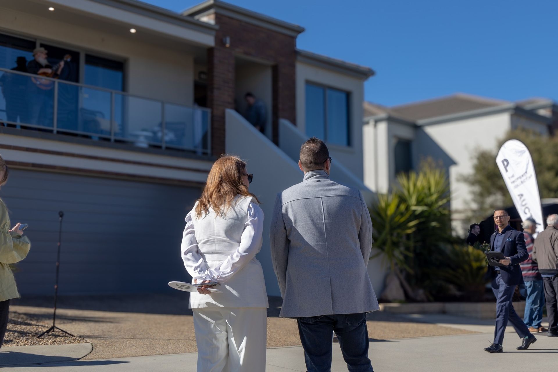 Canberra Property Auction Buyers Observing Modern Home