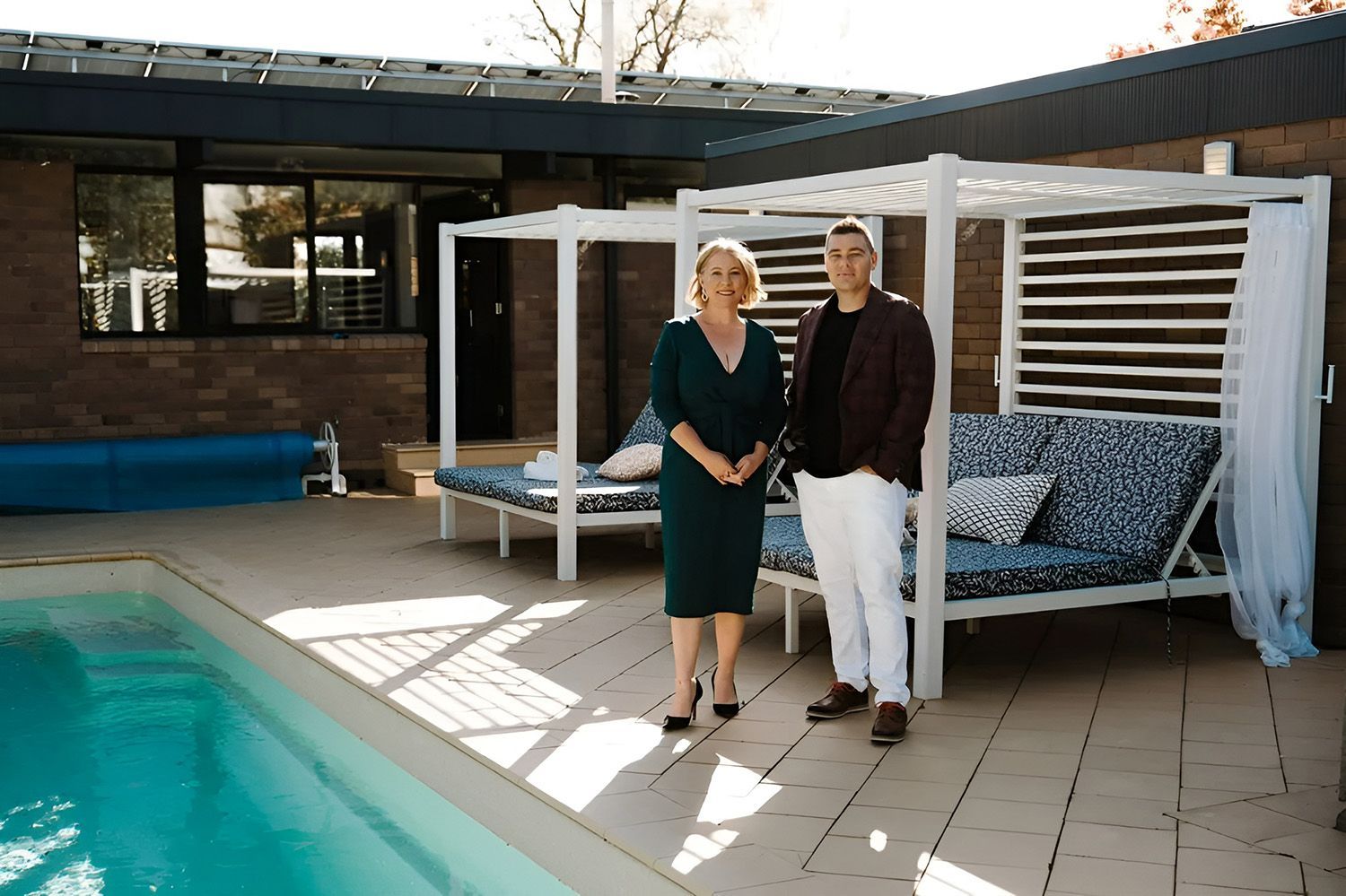 Buyers Advocate Standing on the Pool Area