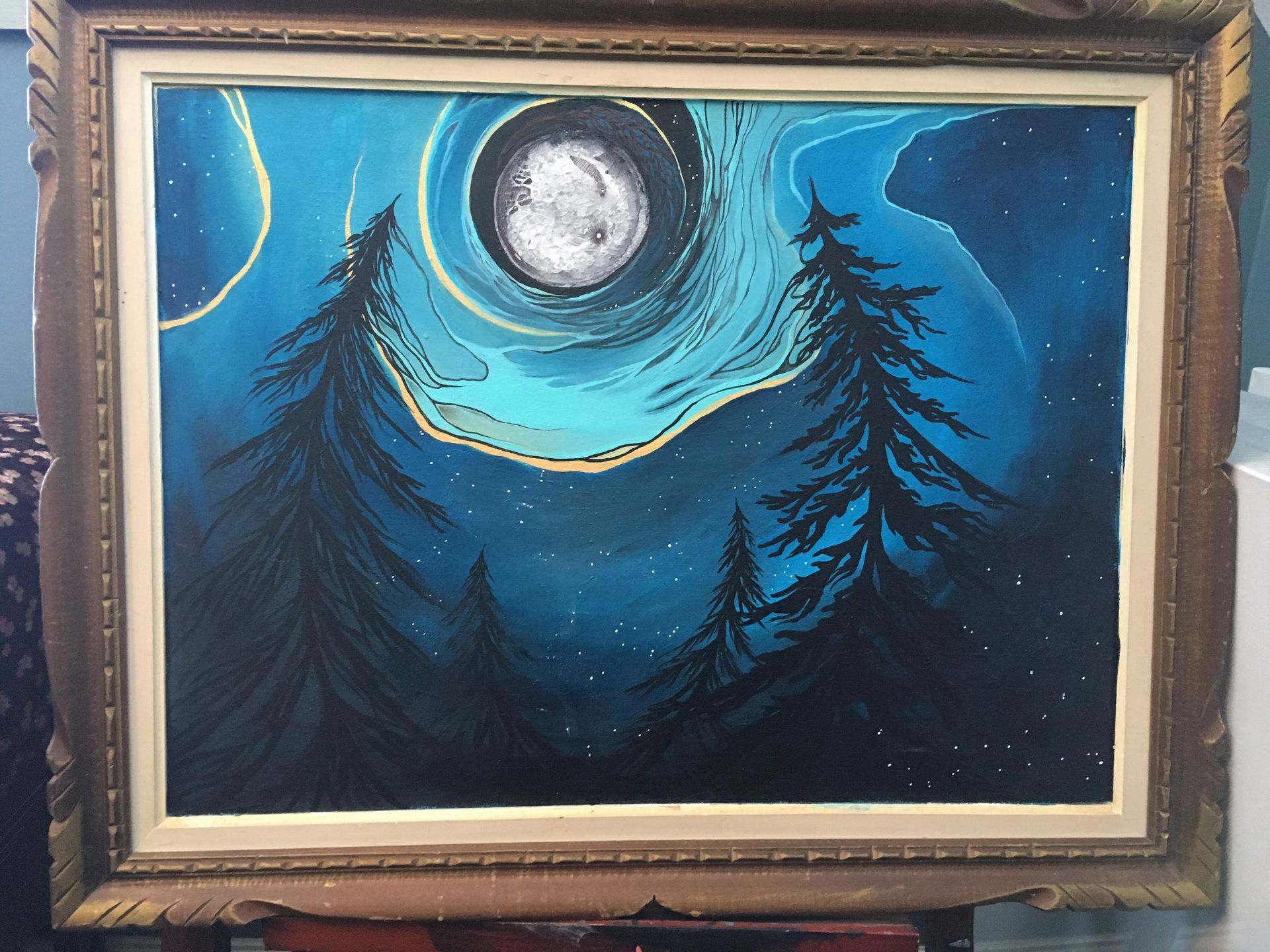 A painting of 4 trees silhouettes with a blue background of various hues and a moon illuminating the scene. Flowy lines appear to symbolize communication between this family of trees.