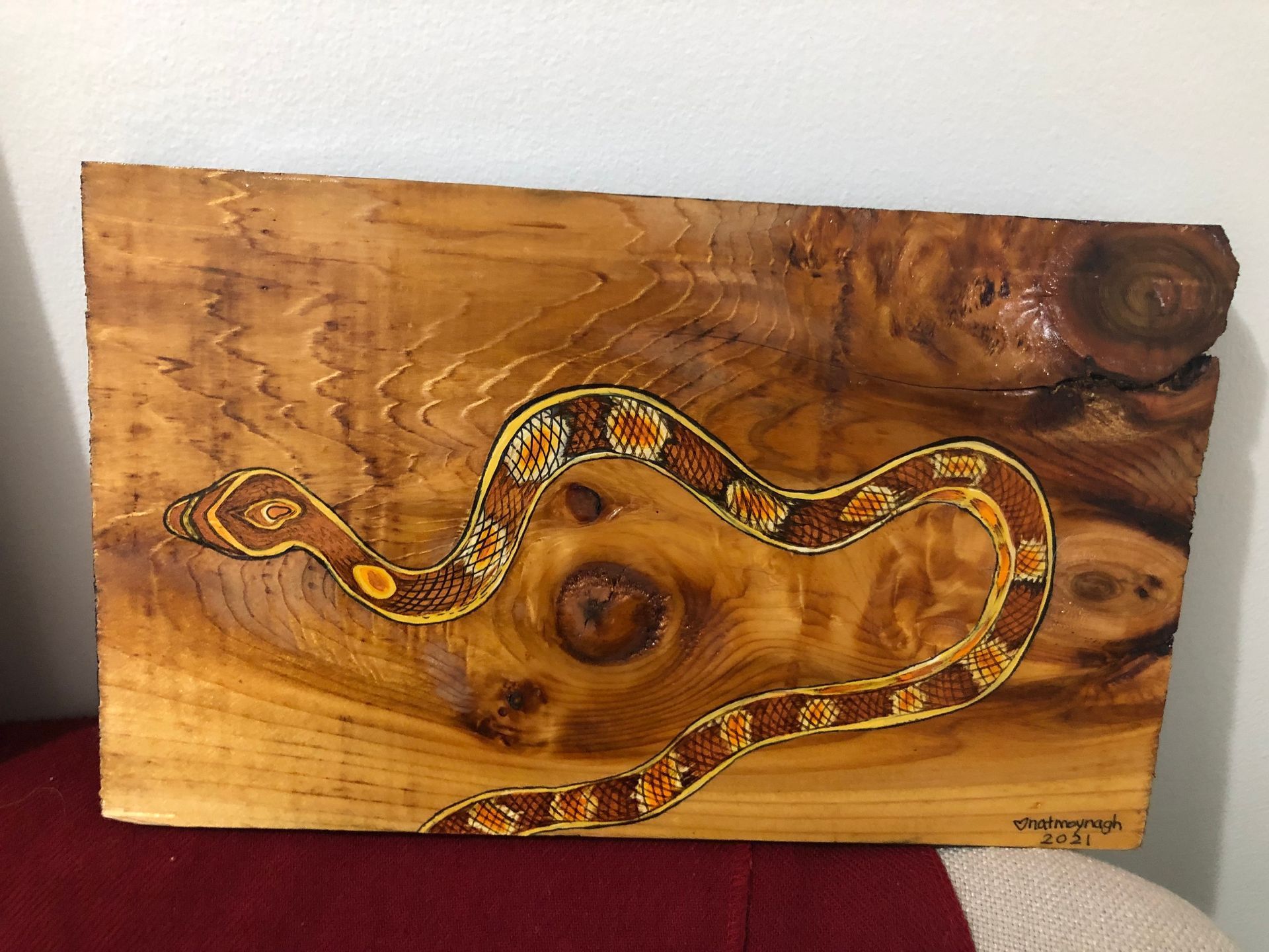 Painting of a snake I dreamt of which in the dream had shed it's skin but here it is free of that old cassing, slithering by with its fresh shiny, yellow and red body, maybe an Eastern Coral Snake or something of the like.