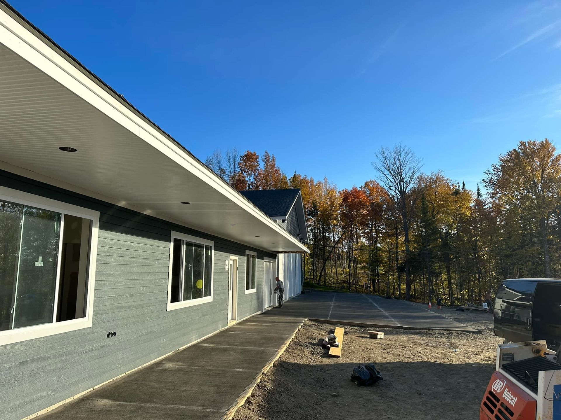 A house with a lot of windows is being built.
