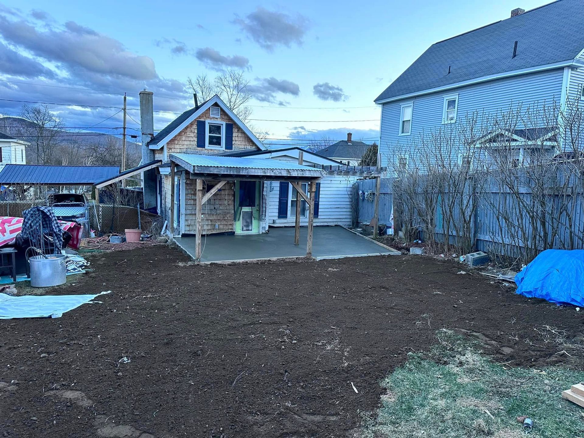 A house is being built in the backyard of a house.