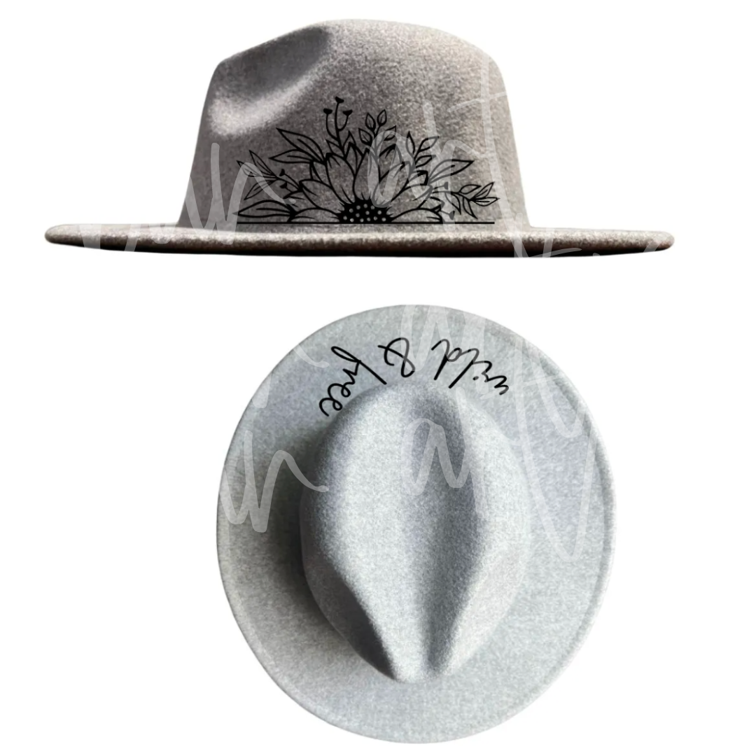 A hat with a flower and the words mr. and mrs. written on it