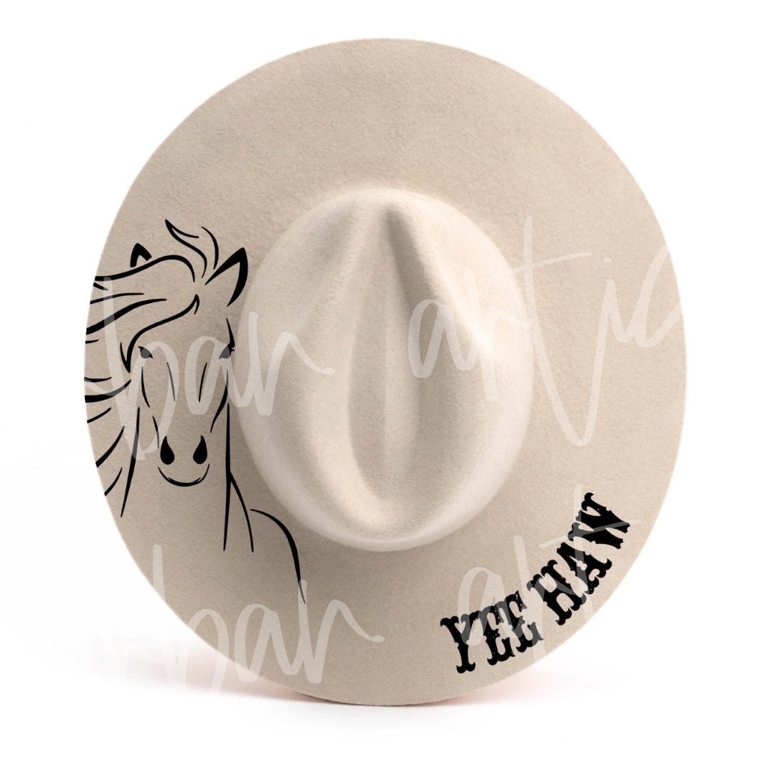 A cowboy hat with yee haw embroidered on it
