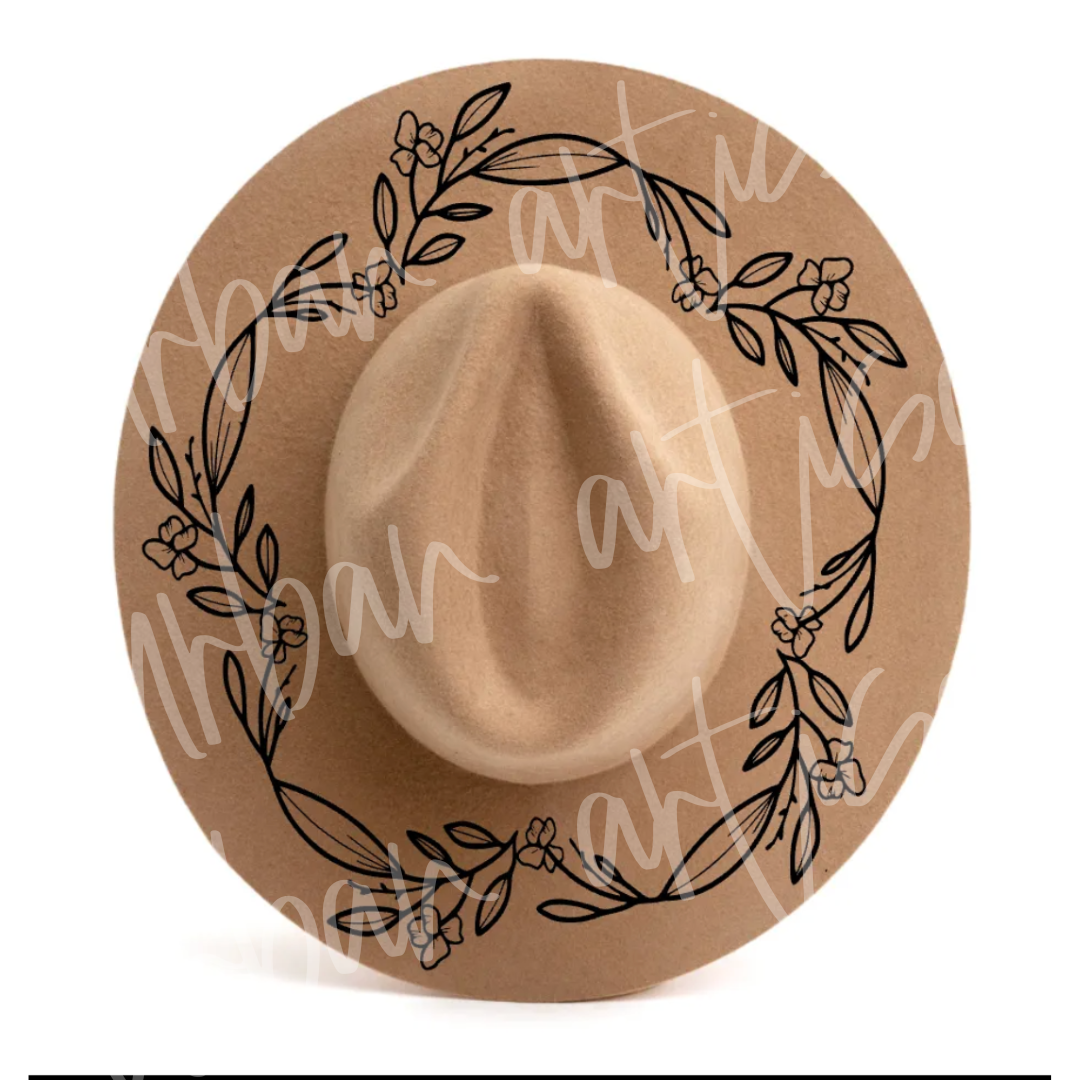 A hat with a wreath of leaves painted on it