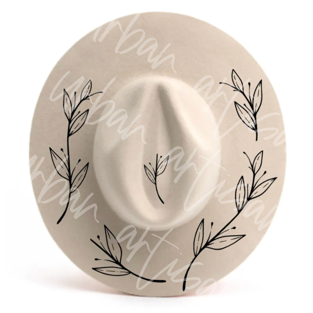 A white hat with leaves painted on it